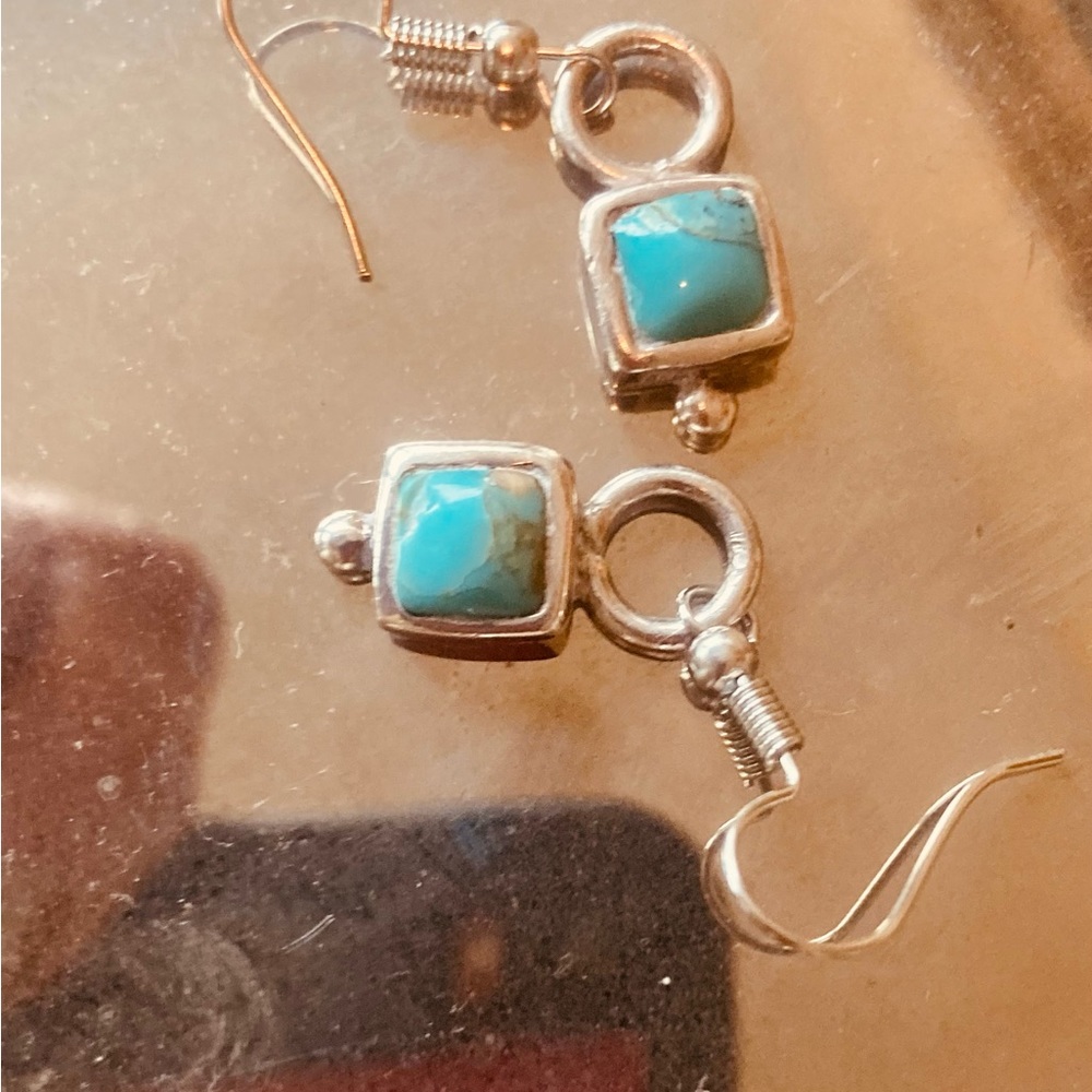 Turquoise on sterling silver mount earrings Genuine turquoise set in sterling.
